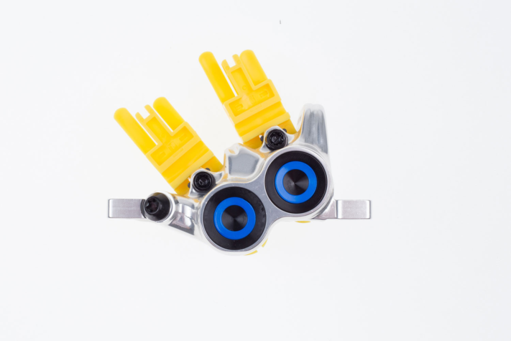 Magura Bremszange MT Trail Carbon Vorderrad 4-Kolben, Chrom poliert, Blende blau, drehbarer Leitungsansc...